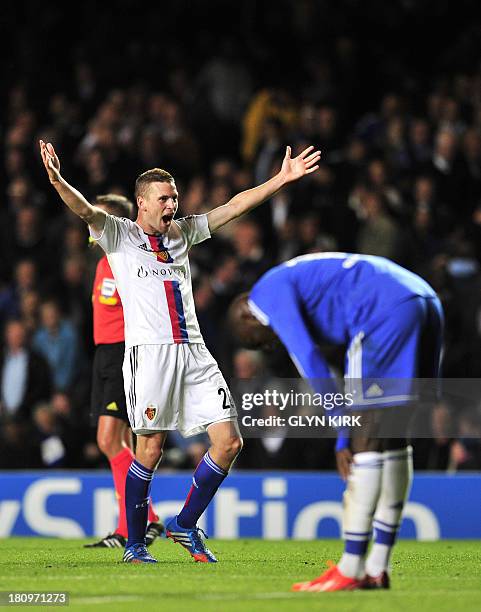 Basel's Swiss midfielder Fabian Frei celebrates winning the UEFA Champions League Group E football match against Chelsea at Stamford Bridge in London...