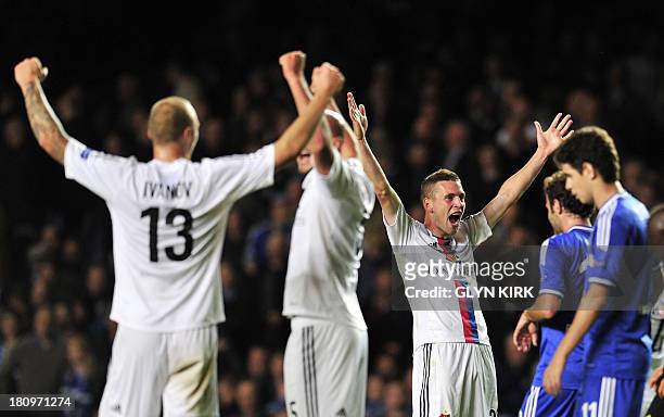 Basel's Swiss midfielder Fabian Frei celebrates winning the UEFA Champions League Group E football match against Chelsea at Stamford Bridge in London...