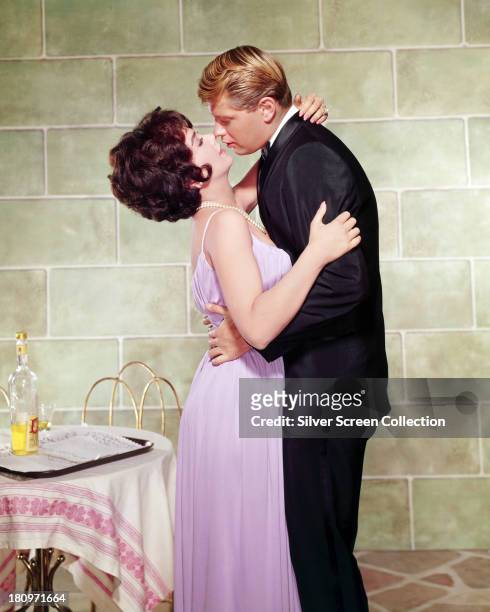 American actors Troy Donahue , as Don Porter, and Suzanne Pleshette as Prudence Bell, in a promotional still for 'Rome Adventure', , directed by...