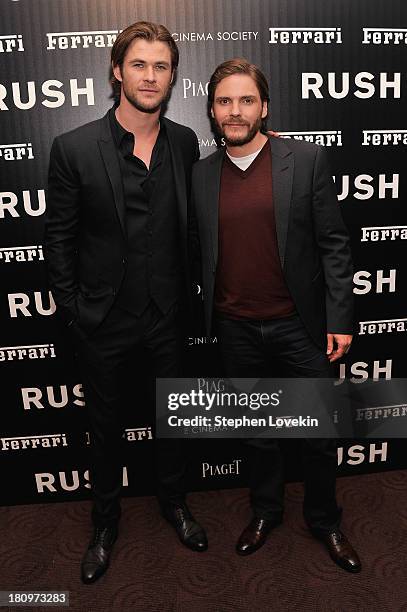 Actors Chris Hemsworth and Daniel Brühl attend the Ferrari and The Cinema Society Screening of "Rush" at Chelsea Clearview Cinemas on September 18,...