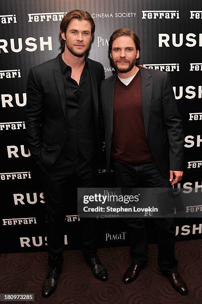 Actors Chris Hemsworth and Daniel Brühl attend the Ferrari and The Cinema Society Screening of "Rush" at Chelsea Clearview Cinemas on September 18,...