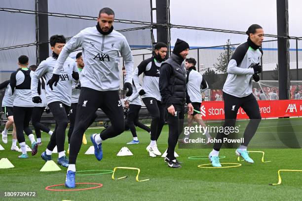 Joel Matip and Virgil van Dijk captain of Liverpool during a training session at AXA Training Centre on November 23, 2023 in Kirkby, England.