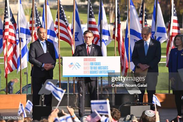 House Minority Leader Hakeem Jeffries , U.S. Speaker of the House Mike Johnson , and Senate Majority Leader Chuck Schumer, , appear onstage during...