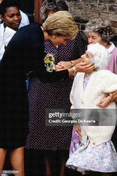 Diana, Princess of Wales, greets Nellie Corbett during her visit to the Lord Gage Centre for old people, a guinness trust home In Newham, East London...