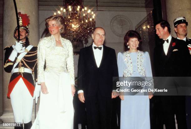 Diana, Princess of Wales, former French President Francois Mitterrand, First Lady Danielle Mitterrand and Charles, Prince of Wales, attend a banquet...
