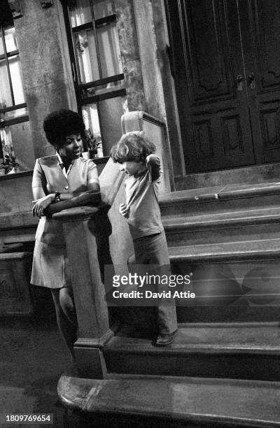 Actress Loretta Long talks to the photographer's son, Oliver Attie, during a break in the taping of Sesame Street's very first season, taken for...