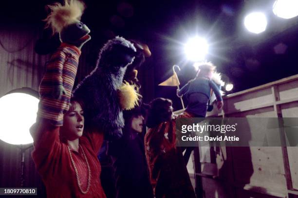 Puppeteers Caroly Wilcox, Daniel Seagren, and Jim Henson holding various muppets during the taping of Sesame Street's very first season, taken for...