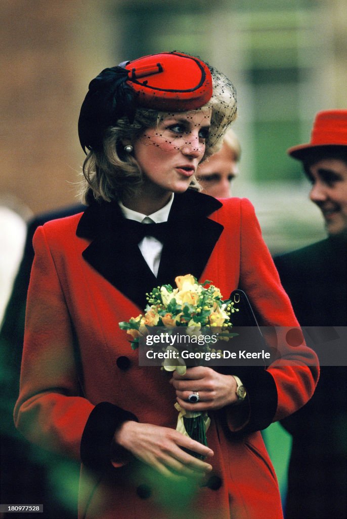 Diana, Princess of Wales, holds a bouquet of flowers during a visit ...