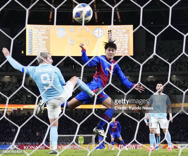 Japan's Ventforet Kofu's Shion Inoue scores the equalizer with a header during the first half of a match against Australia's Melbourne City in the...