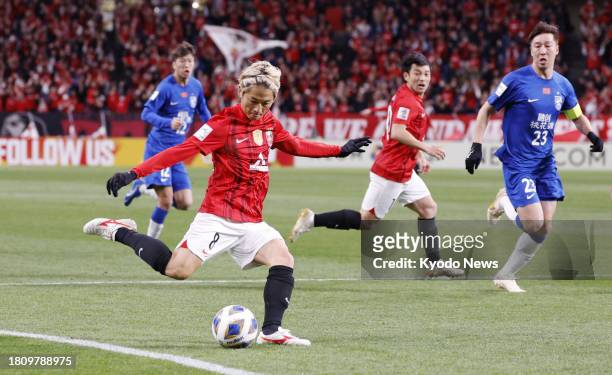 Japan's Urawa Reds midfielder Yoshio Koizumi plays a pass during the first half of a match against China's Wuhan Three Towns in the Asian Champions...