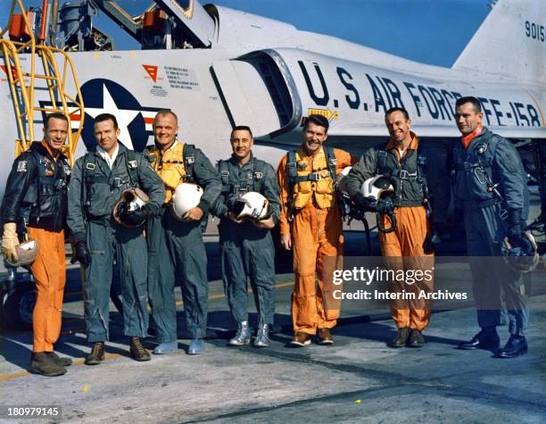 National Aeronautics and Space Administration group portrait of the 'Original Seven' astronauts from the Mercury program as they pose in front of an...