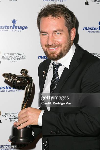 Christian Kuehn receives an award at the International 3D Society & Advanced Imaging Society 3D Products of the Year Awards at Paramount Studios on...