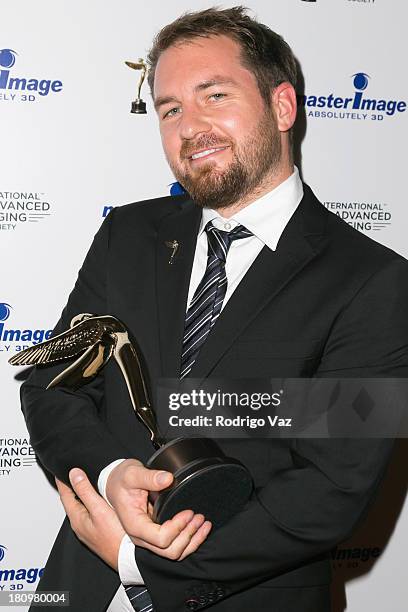 Christian Kuehn receives an award at the International 3D Society & Advanced Imaging Society 3D Products of the Year Awards at Paramount Studios on...