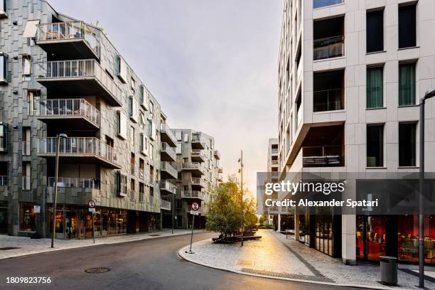 sun shining through the streets of oslo, norway - oslo business stock pictures, royalty-free photos & images