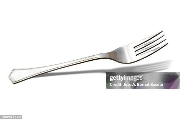 close-up of cutlery, fork, over white background with small shadow. - bestek stockfoto's en -beelden