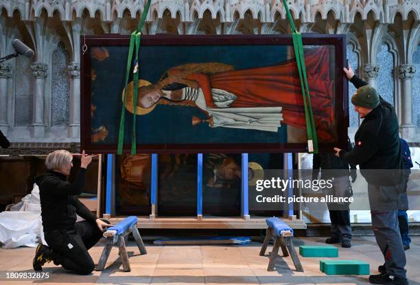 November 2023, Saxony-Anhalt, Naumburg : An altar wing with an image of St. Barbara by Lucas Cranach the Elder in the west choir of Naumburg...