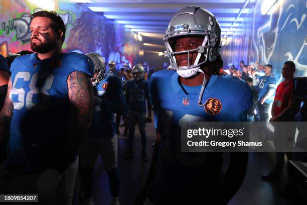 Taylor Decker and Teddy Bridgewater of the Detroit Lions look on prior to a game against the Green Bay Packers at Ford Field on November 23, 2023 in...