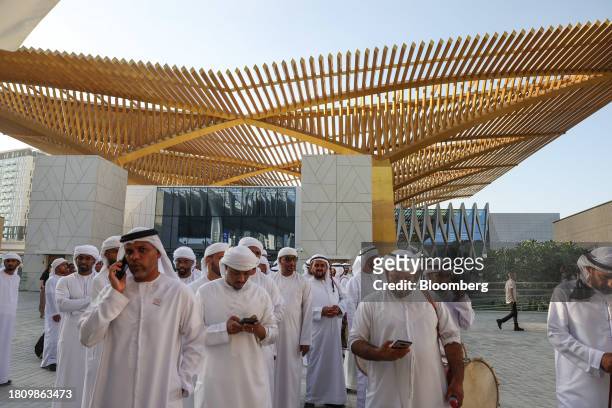 Traditional drumming band from Ras Al Khaimah queue to enter the Blue Zone ahead of the COP28 climate conference at Expo City in Dubai, United Arab...