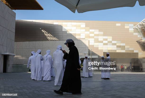 Attendees outside the entrance to the Blue Zone ahead of the COP28 climate conference at Expo City in Dubai, United Arab Emirates, on Wednesday, Nov....