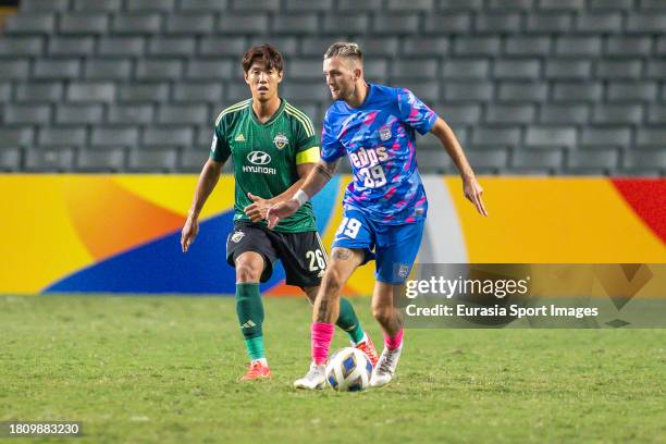 Jakob Jantscher of Kitchee fights for the ball with Hong Jeong-Ho of Jeonbuk Hyundai Motors during the AFC Champions League Group F match between...