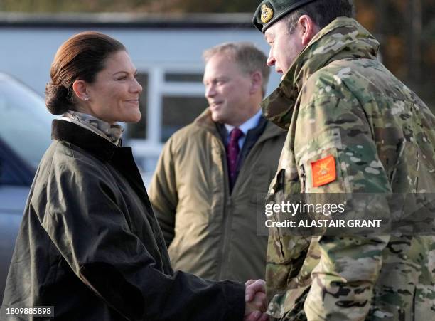 Crown Princess Victoria of Sweden arrives at a military base to visit to visit STANTA training camp in eastern England, on November 29 where Swedish...