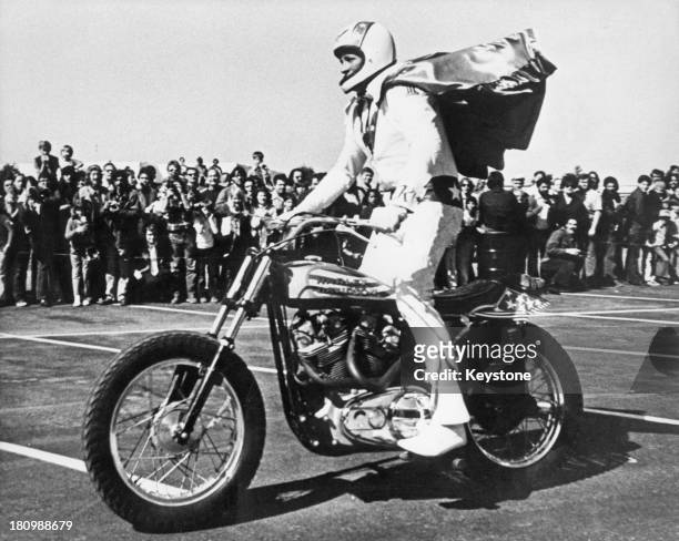 American stunt person Evel Knievel on a Harley Davidson motorcycle, circa 1975.