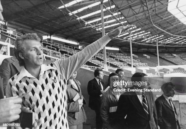 American stunt person Evel Knievel visits Wembley Stadium in preparation for his upcoming attempt to jump thirteen buses inside the stadium, London,...