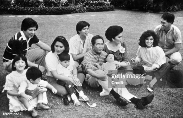 Philippines President Ferdinand Marcos poses with the members of his family ; his wife Imelda , eldest daughter Imee and her husband Tomas Manotoc ,...
