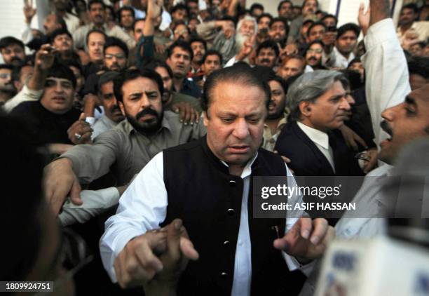 Former Pakistani premier Nawaz Sharif is surrounded by supporters during a rally in the central city of Gujranwala on March 16, 2009. Pakistan's main...