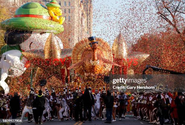 Confetti fills the air with a turkey balloon at the start of the Macy's Thanksgiving Day parade on November 23 in New York City.