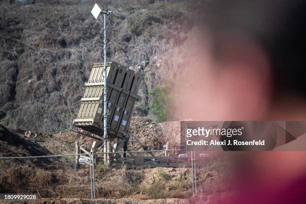 Soldiers stand near an Israeli Air Force Iron dome defense system on November 23, 2023 in Central Israel. Over 10,000 rockets have been fired since...