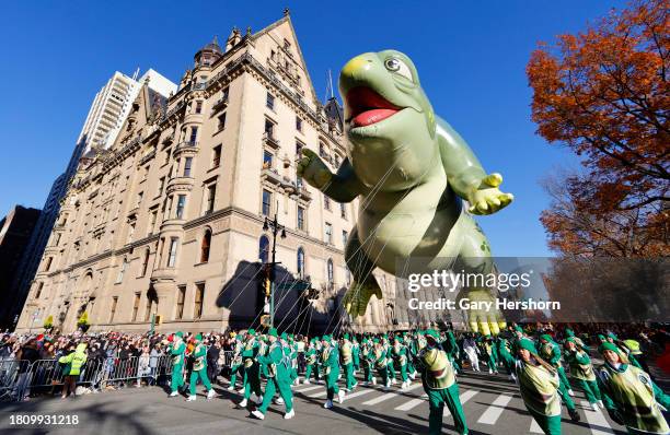 The Leo the Lizard balloon floats down Central Park West during the Macy's Thanksgiving Day Parade on November 23 in New York City.