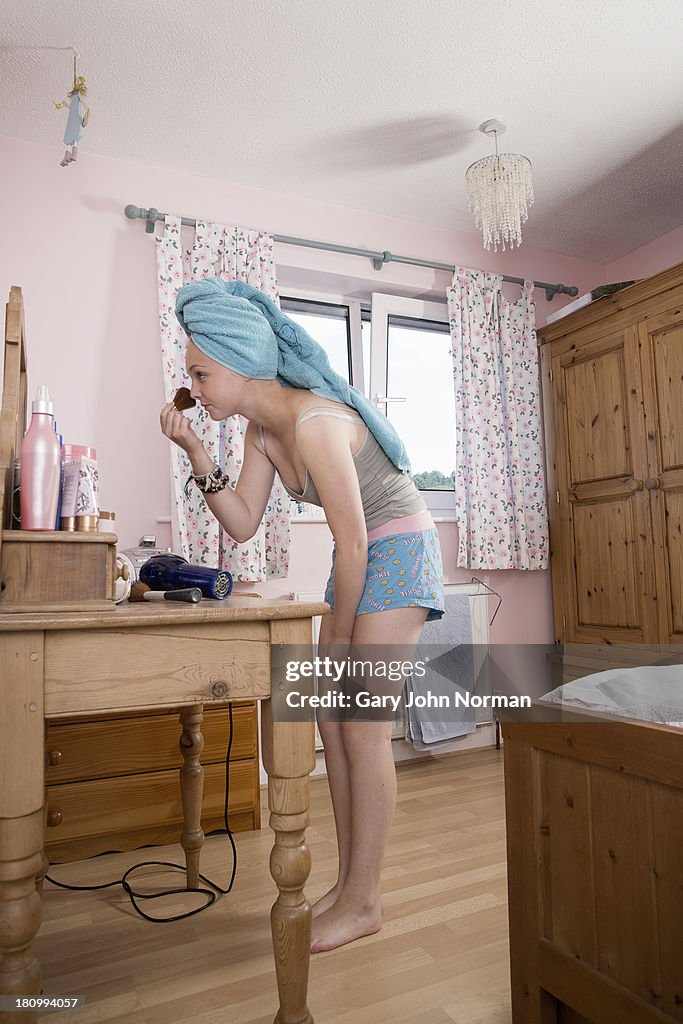 Teenage girl in her bedroom