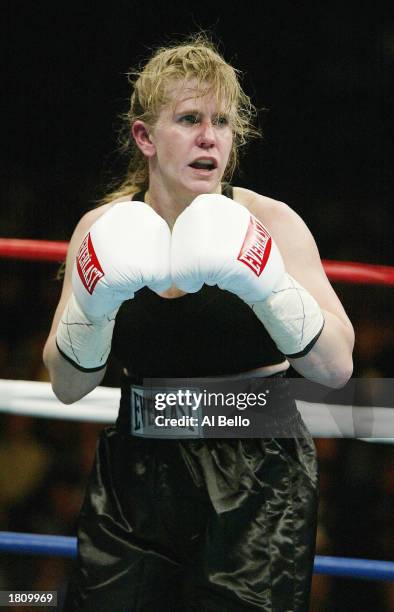 Tonya Harding waits on Samantha Browning during their women's bantamweight bout at The Pyramid on February 22, 2003 in Memphis, Tennessee. Browning...