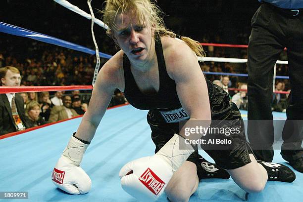 Tonya Harding falls to the floor during her fight with Samantha Browning in a second round during their women's bantamweight bout at The Pyramid on...