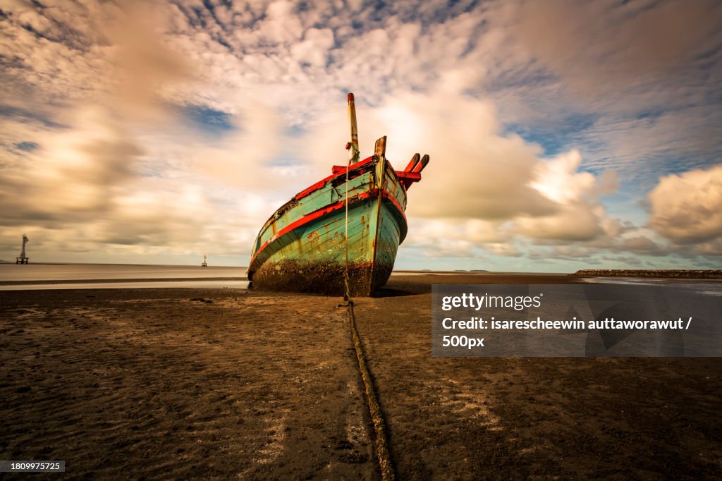 A old shipwreck boat abandoned stand on beach