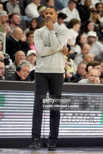 Head coach Kim English of the Providence Friars looks on during a college basketball game against the Wisconsin Badgers at Amica Mutual Pavilion on...