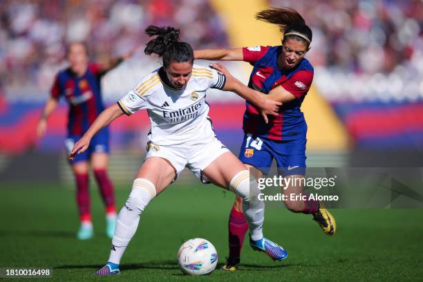 Ivana Andres of Real Madrid challenges for the ball against Aitana Bonmati of FC Barcelona during the Liga F match between FC Barcelona and Real...