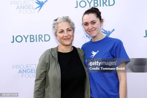Em Beihold and guest attend Thanksgiving at Project Angel Food on November 23, 2023 in Los Angeles, California.