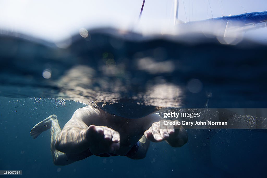 Man swimming in sea,underwater