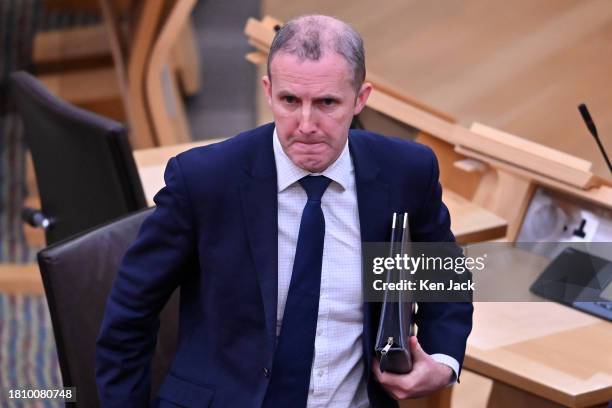 Health Secretary Michael Matheson leaves the chamber following NHS Recovery, Health and Social Care Portfolio Questions in the Scottish Parliament,...