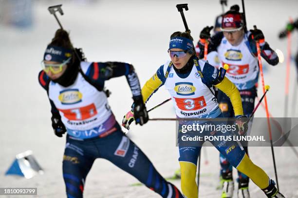 France's Lou Jeanmonnot competes ahead of Sweden's Anna Magnusson during the women's 4x6 km relay event of the IBU Biathlon World Cup at the ski...