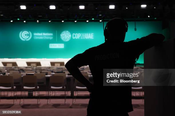 Broadcast worker inside a plenary room ahead of the COP28 climate conference at Expo City in Dubai, United Arab Emirates, on Wednesday, Nov. 29,...