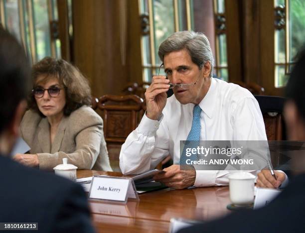 Senate Foreign Relations Committee Chairman John Kerry and his wife Teresa Heinz Kerry meet with Chinese officers meet with Chinese officials during...