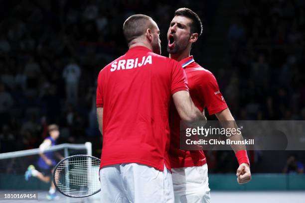 Novak Djokovic of Serbia celebrates winning match point during the Quarter-Final match against Cameron Norrie of Great Britain in the Davis Cup Final...