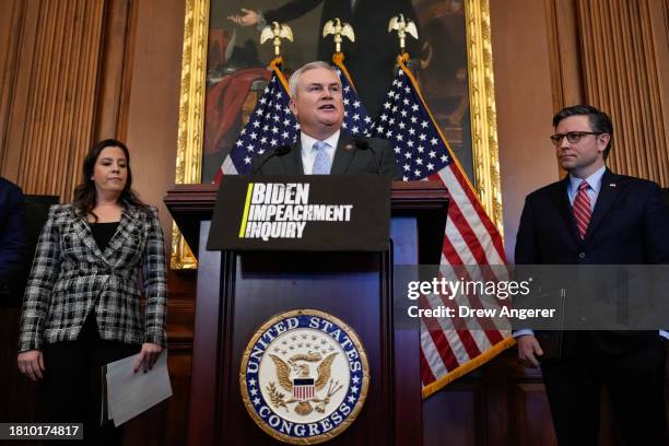 Flanked by, L-R, Rep. Elise Stefanik and U.S. Speaker of the House Mike Johnson , Rep. James Comer speaks during a news conference with House...