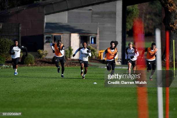 Ian Maatsen, Lesley Ugochukwu, Raheem Sterling, Marc Cucurella, Mykhailo Mudryk and Enzo Fernandez of Chelsea during a training session at Chelsea...
