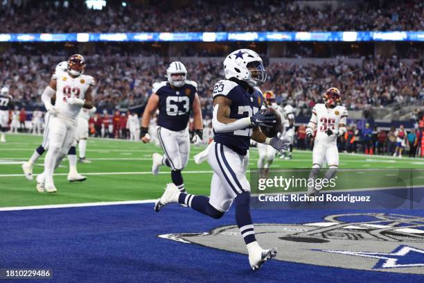 Rico Dowdle of the Dallas Cowboys catch a pass for a touchdown during the first quarter in the game against the Washington Commanders at AT&T Stadium...