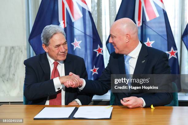 New Zealand First leader Winston Peters and Incoming Prime Minister Christopher Luxon sign the coalition agreement during a signing ceremony at...