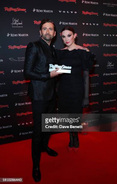 Juno Dawson and David Tennant with his TV Award for Doctor Who, pose in the press room during the inaugural Rolling Stone UK Awards at The Roundhouse...